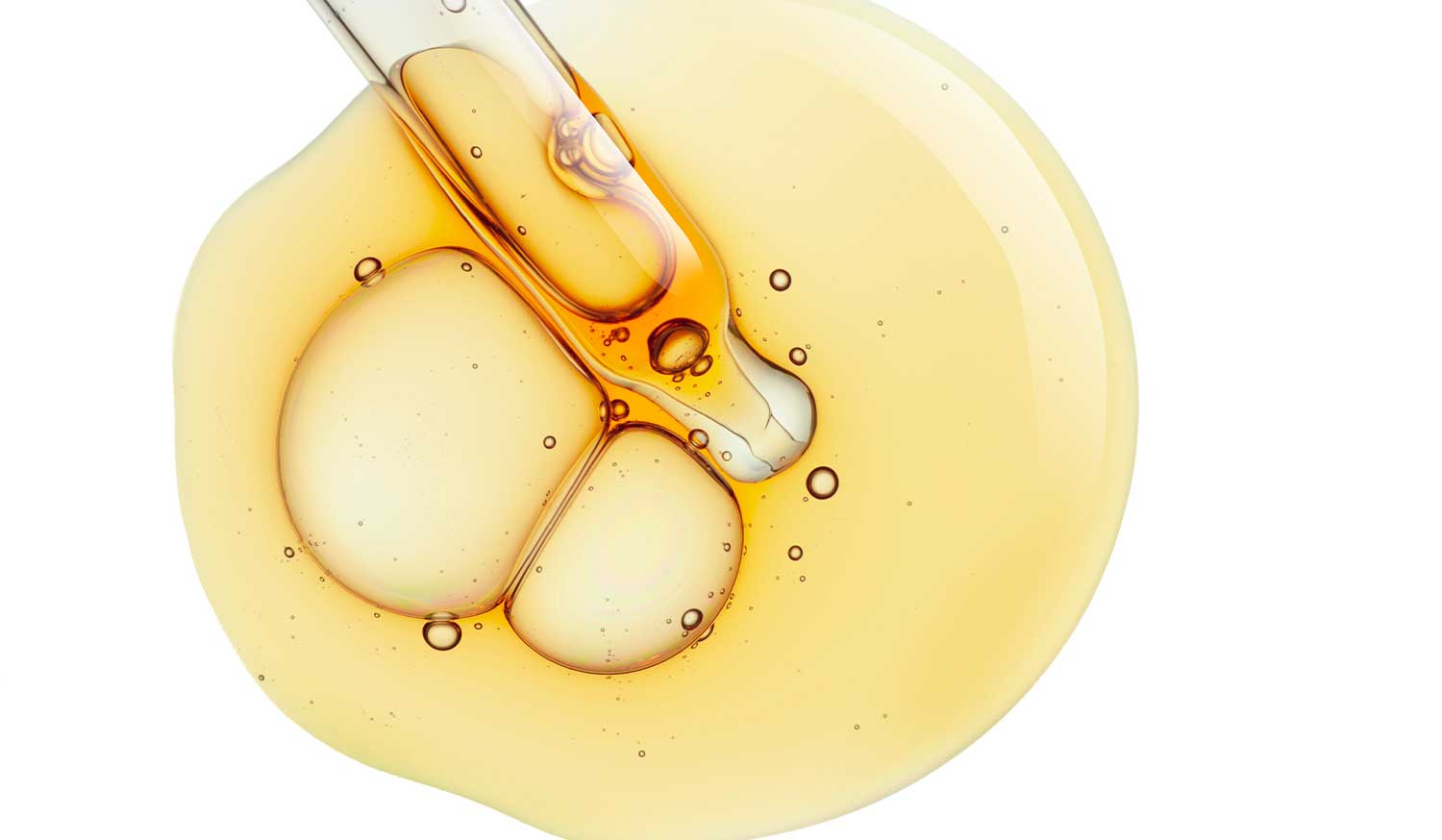 Dropper of First Lady Bright Express Turmeric with Saffron dark spot brightening serum with golden oil droplets