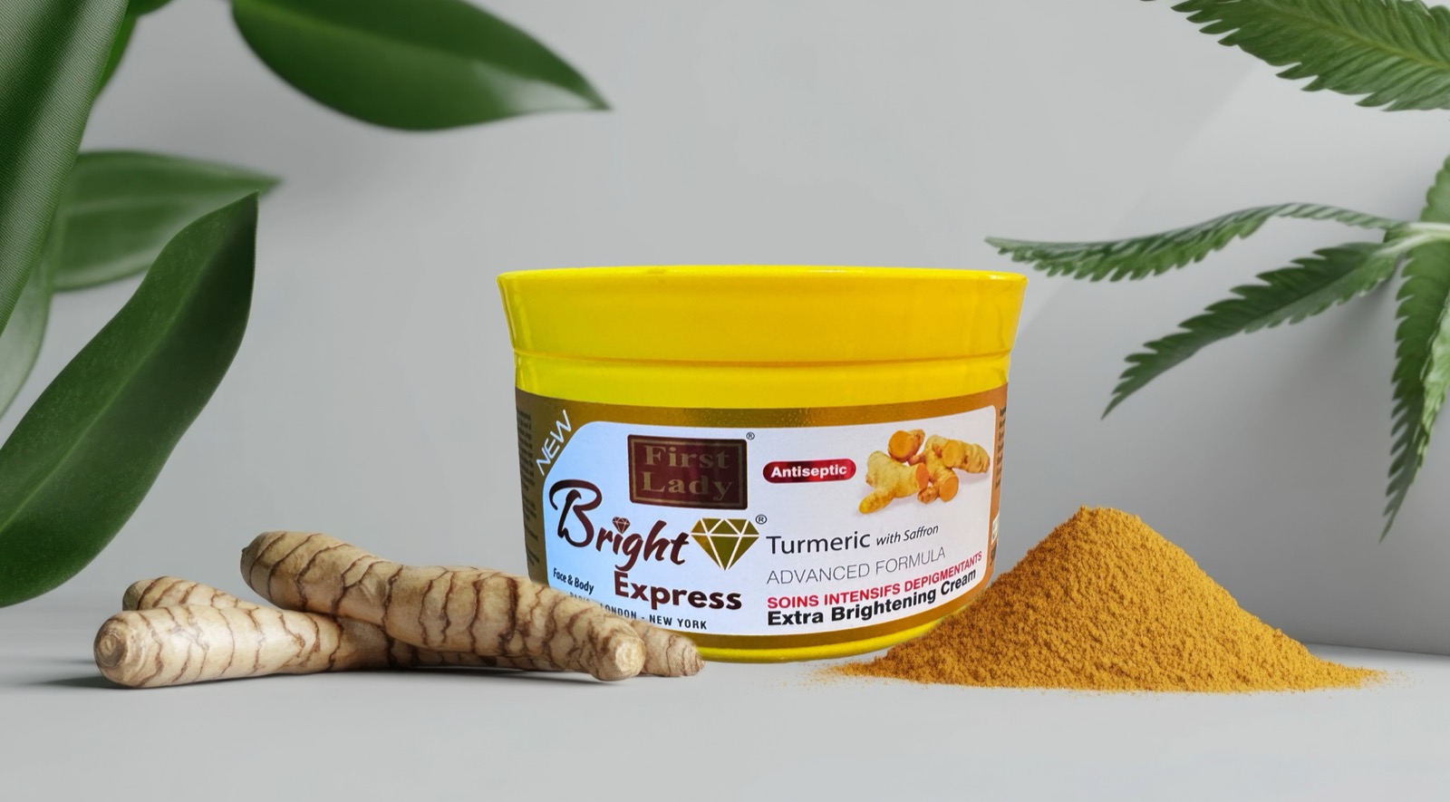 Turmeric kojic acid brightening cream jar surrounded by fresh turmeric root and powder